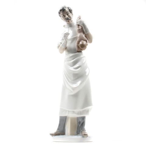 Lladro Facing The Wind Figurine